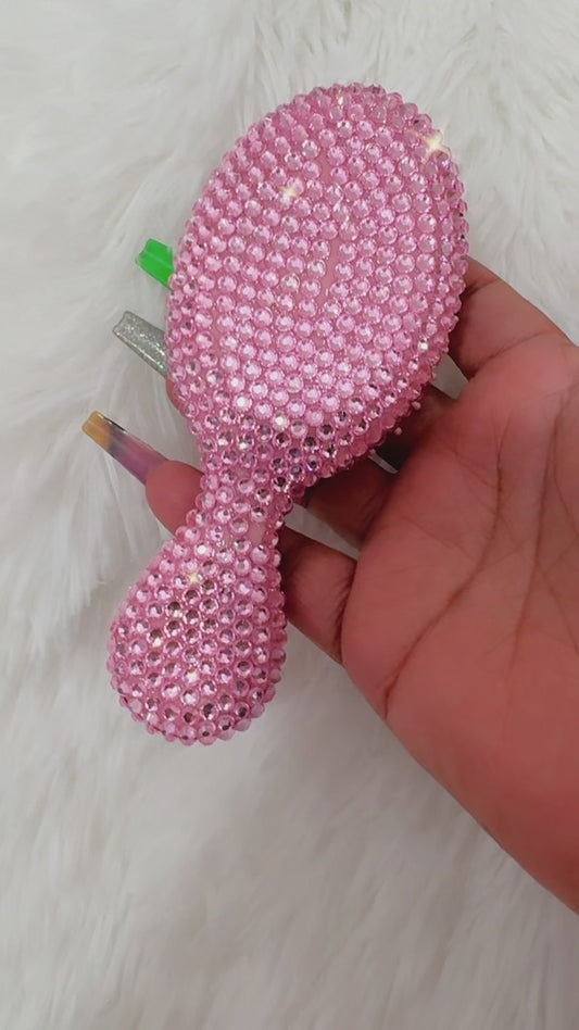 Light pink hair brush